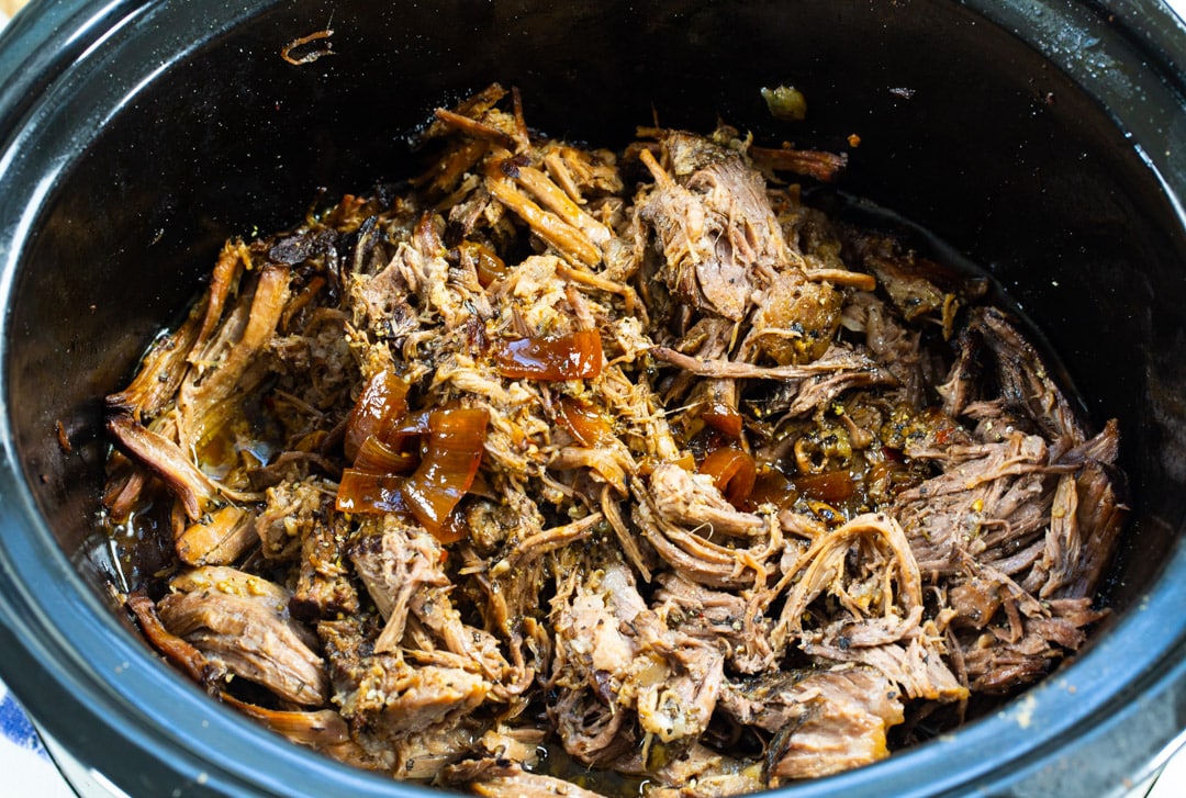 Shredded beef in slow cooker.