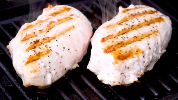 Two grilled chicken breasts.