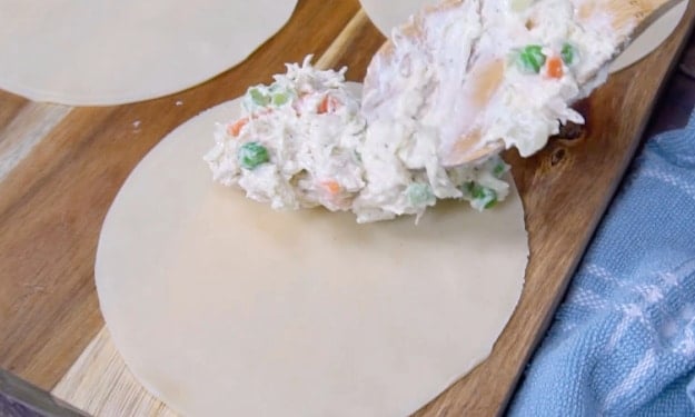Placing filling on dough.
