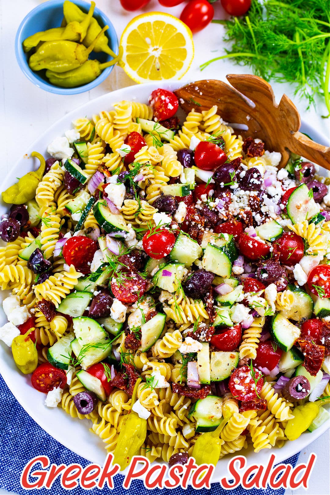 Greek Pasta Salad in a mixing bowl.