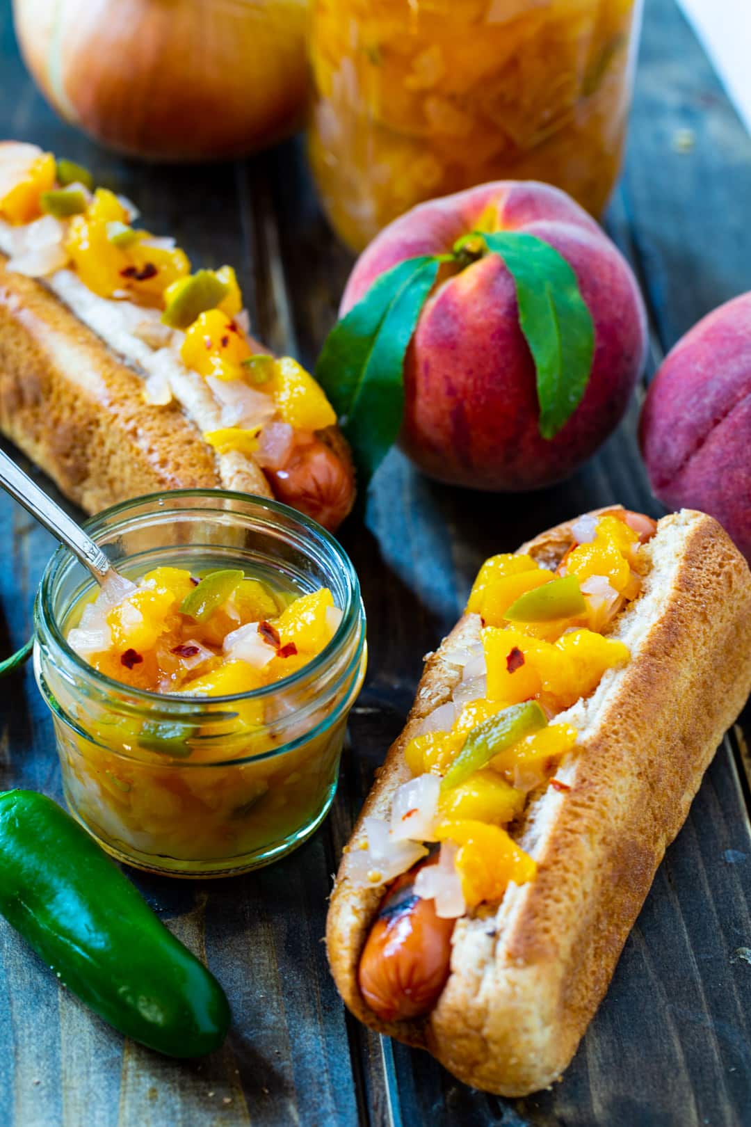 Peach Relish connected  apical  of Hot Dogs.