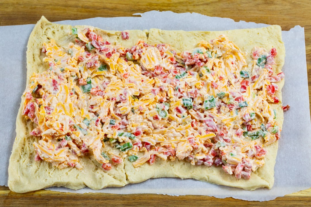 Pimento cheese spread on crescent dough.