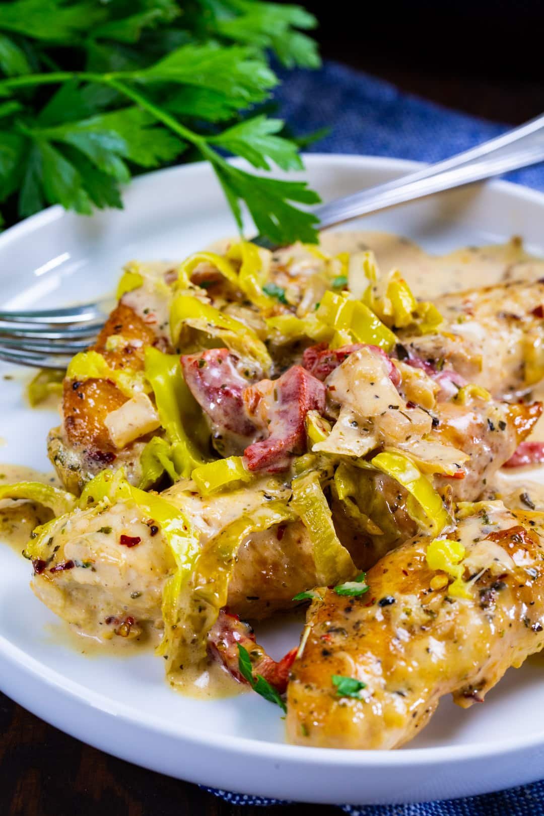 Creamy Pepperoncini Chicken dished up on a plate.