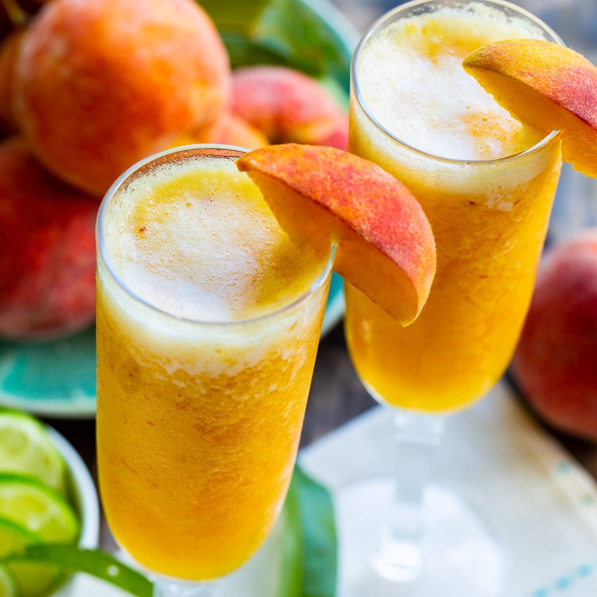 Frozen Peach Bellini Mocktail in two glasses.