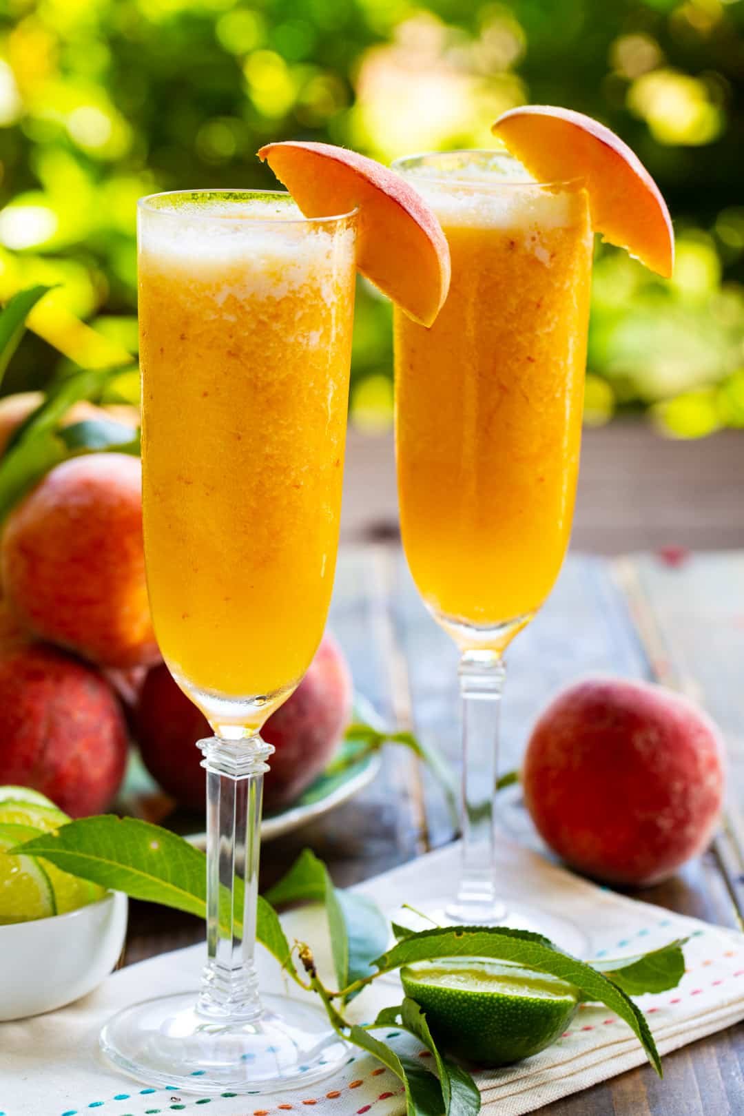 Two glasses full of Frozen Peach Bellini Mocktail.