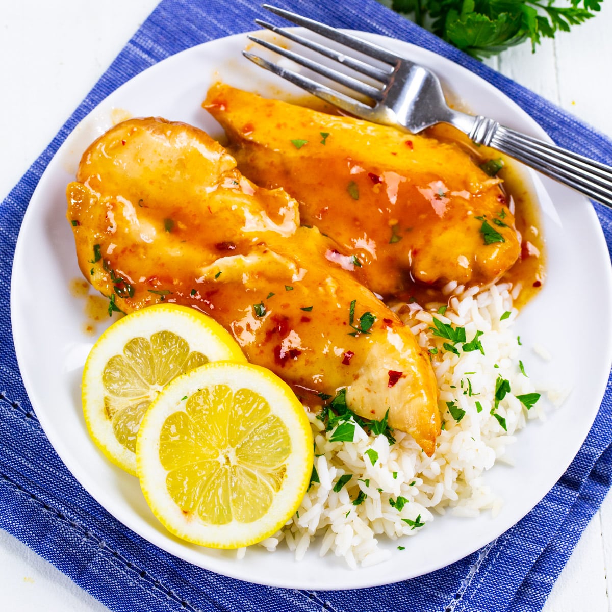 Slow Cooker Lemonade Chicken on a plate with rice.