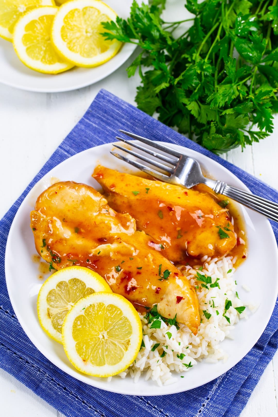 Slow Cooker Lemonade Chicken on plate with rice.