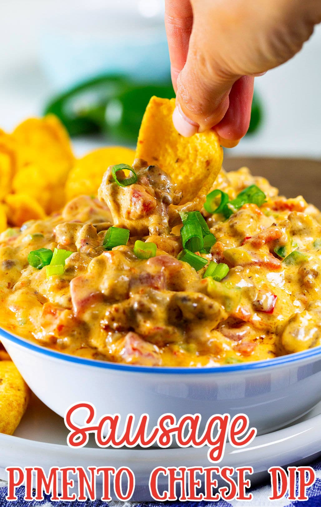 Corn Chip scooping up Pimento Cheese Dip.