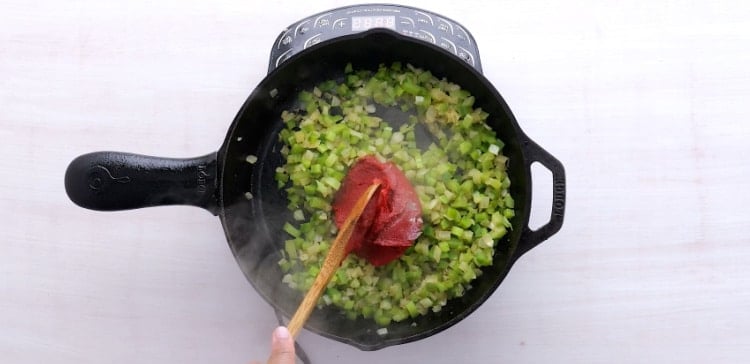 Adding tomato paste.