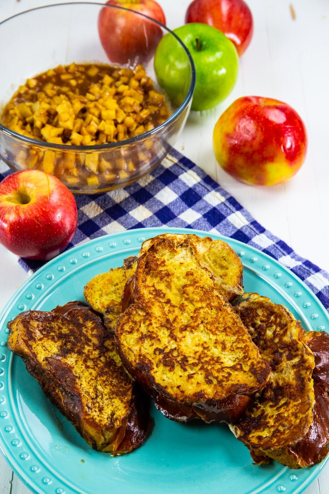 Cooked pieces of French toast on a plate.