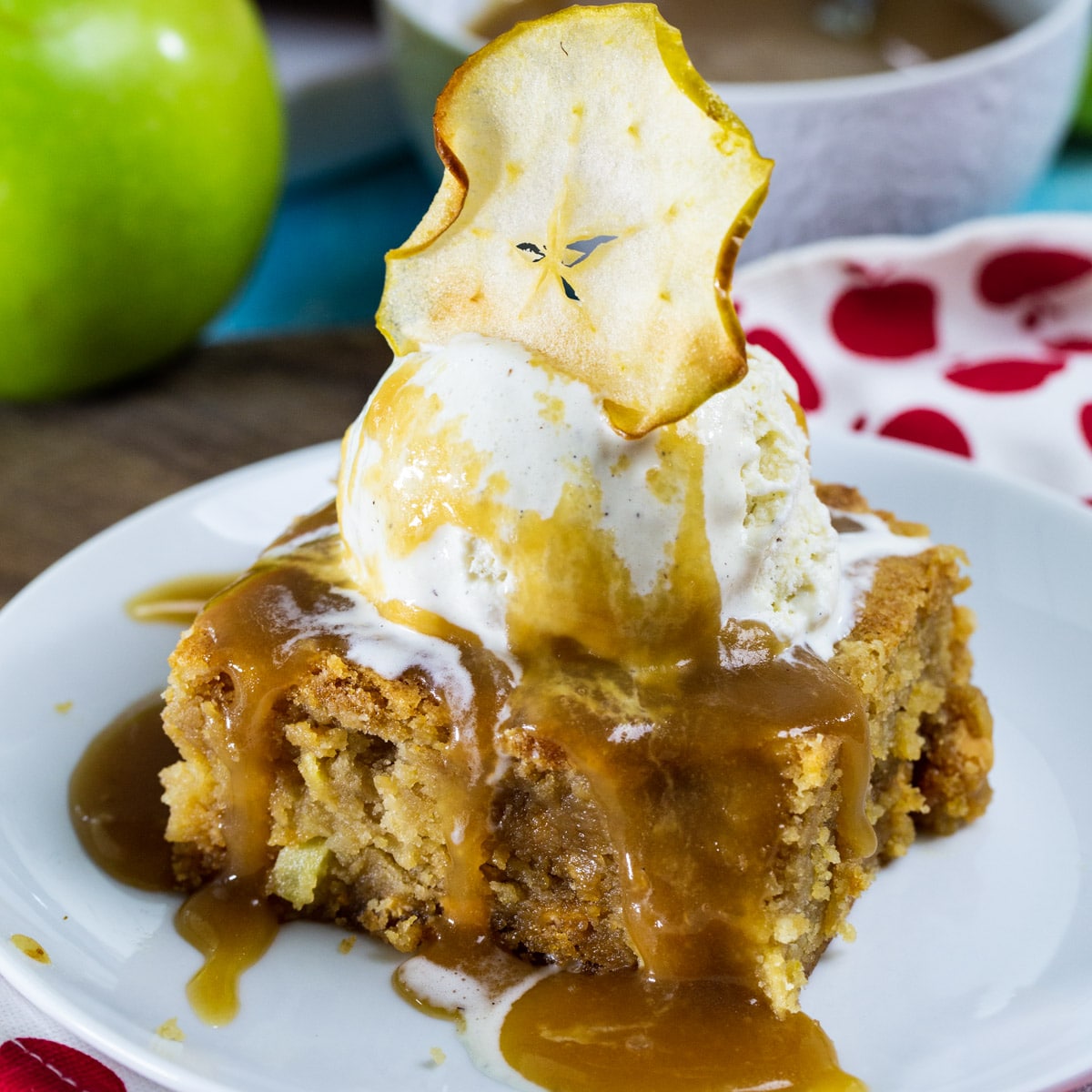 Butterscotch Apple Bars with Caramel Sauce topped with vanilla ice cream.