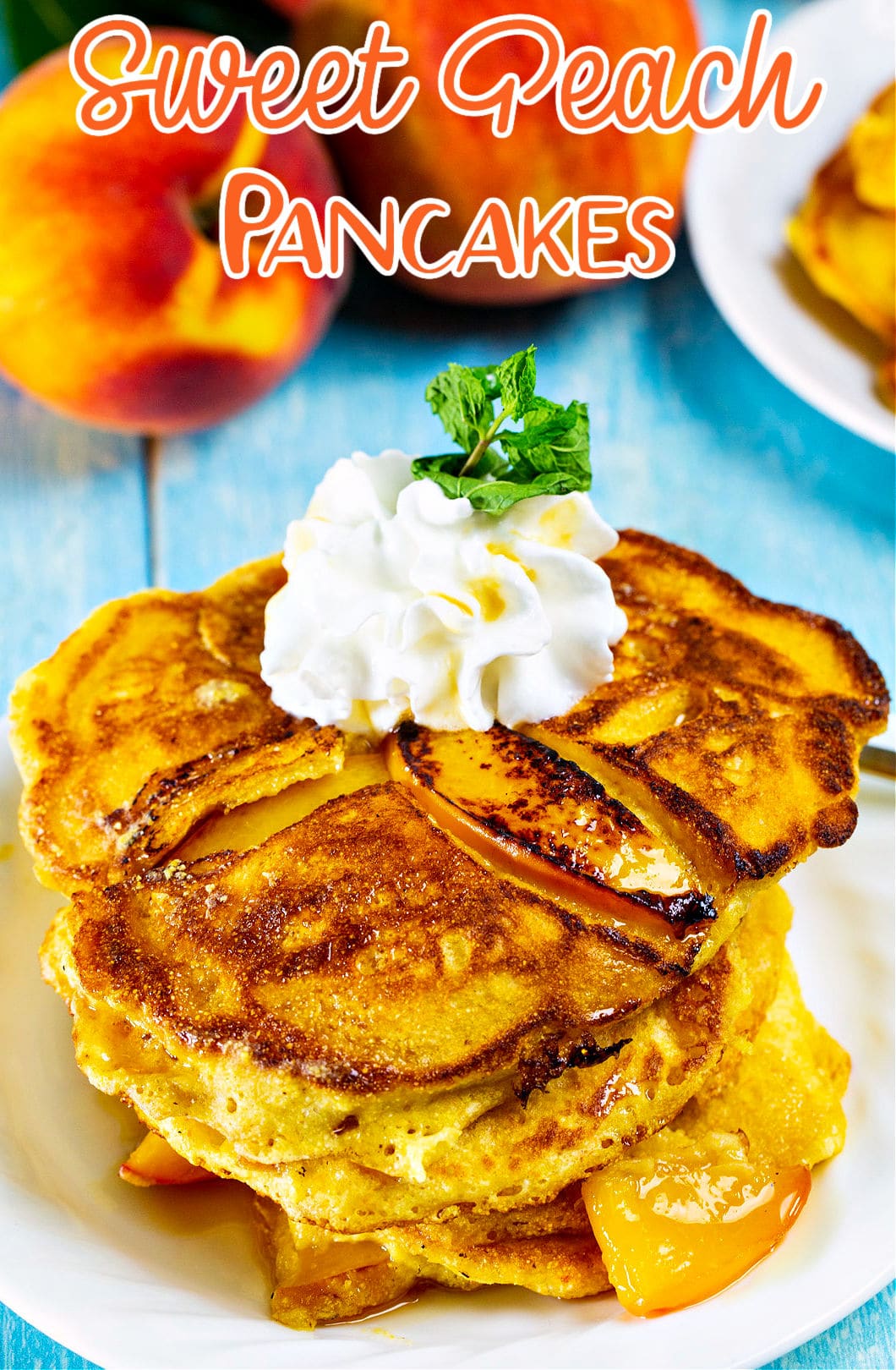 Sweet Peach Pancakes topped with whipped cream and maple syrup.