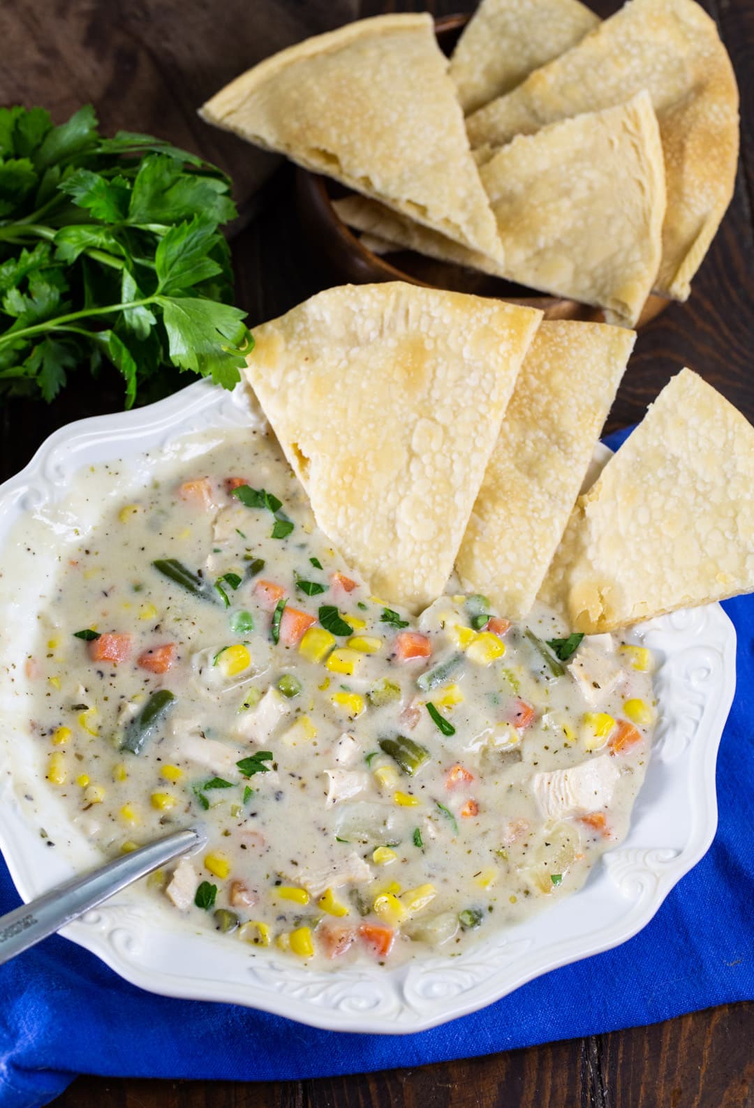 Pot Pie Soup in a bowl with pie crust pieces.