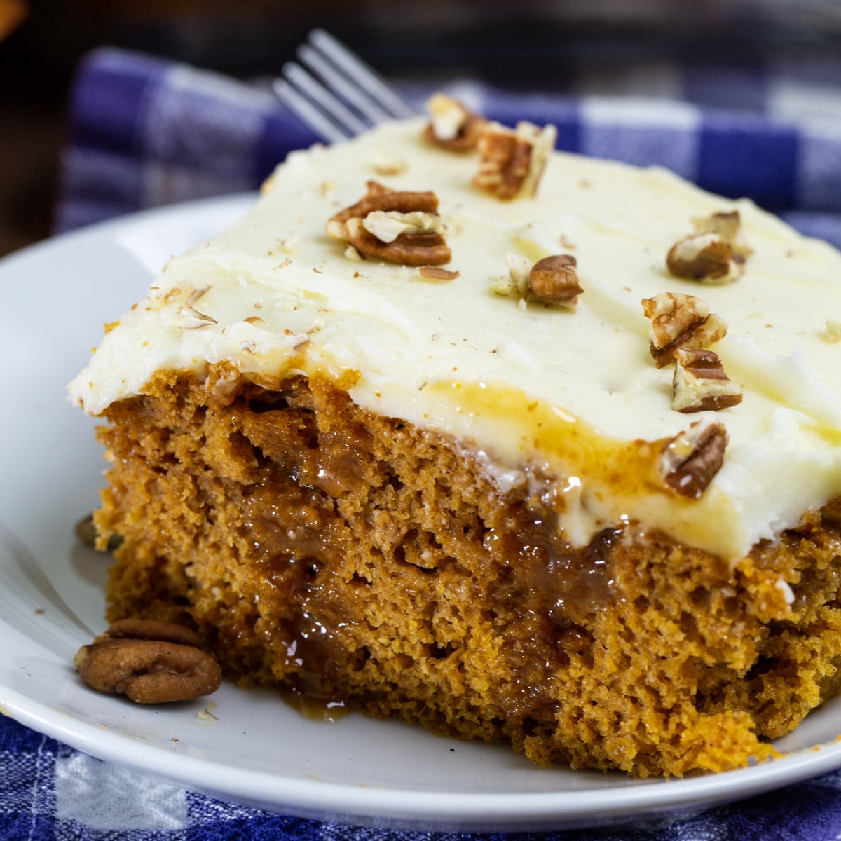 Piece of Pumpkin Caramel Poke Cake on a plate.