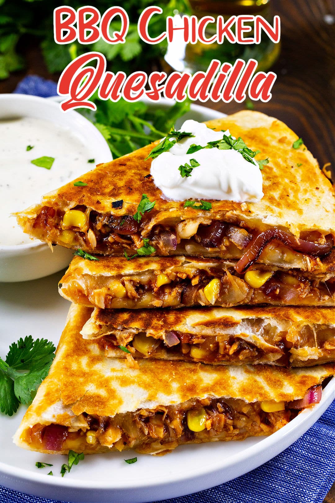 BBQ Chicken Quesadilla wedges piled on a plate.