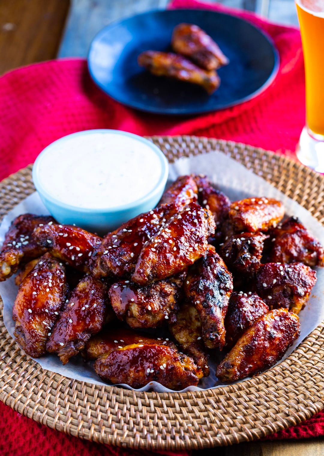 Wings on a serving tray with bowl of ranch dip.
