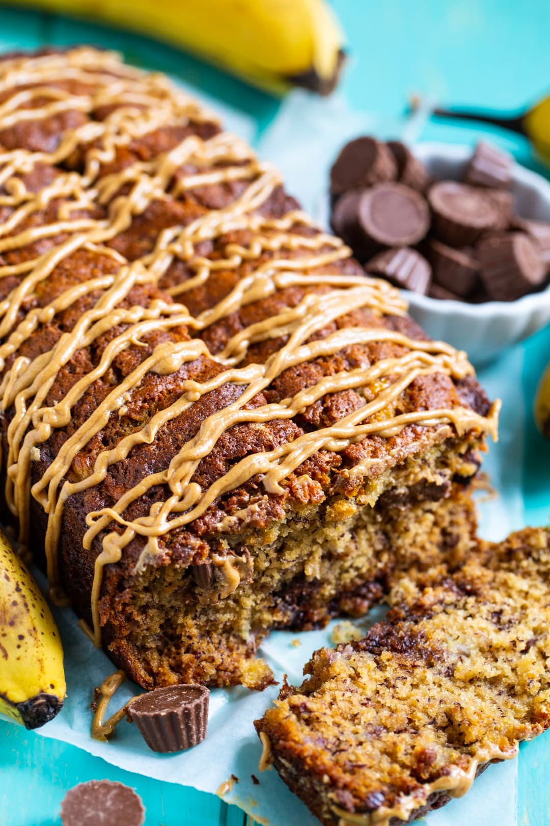 Banana Bread topped with peanut butter drizzle.