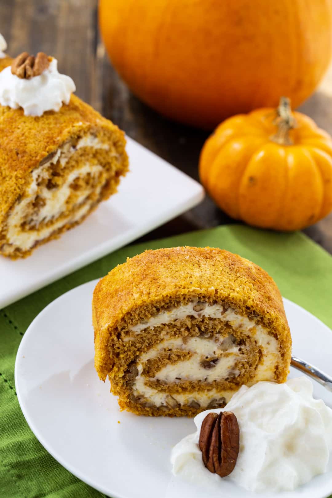 Slice of Pumpkin Cake Roll on a plate.