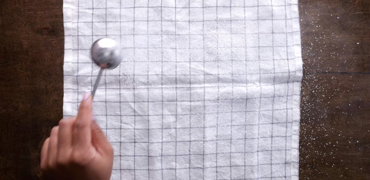 Sprinkling the sugar on the towel.