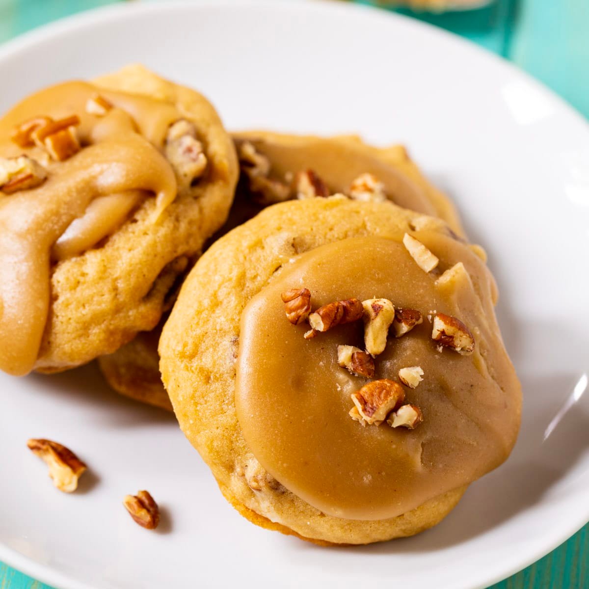 Caramel Frosted Brown Sugar Cookes on a plate.
