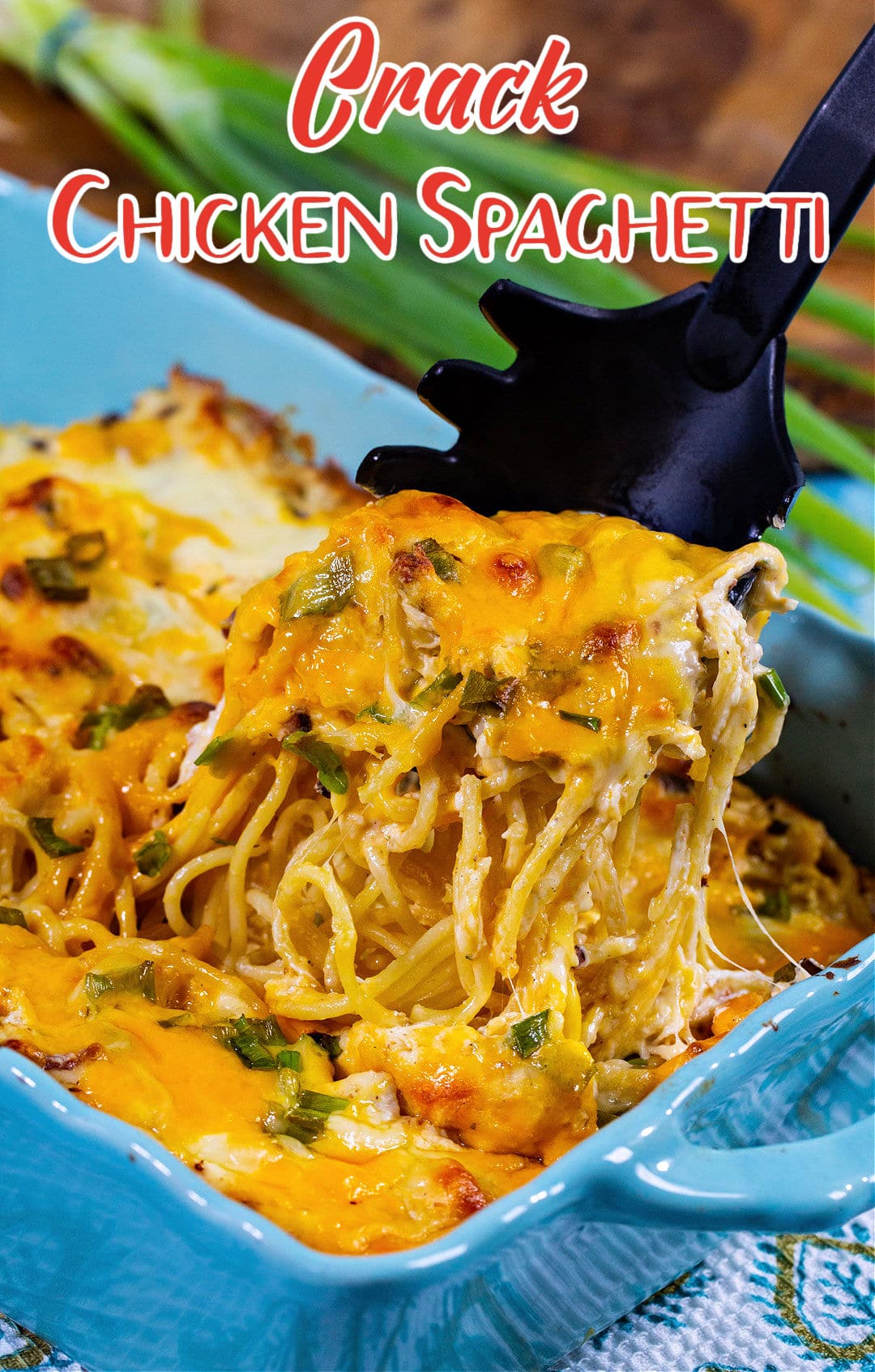 Pasta being lifted out of casserole dish.