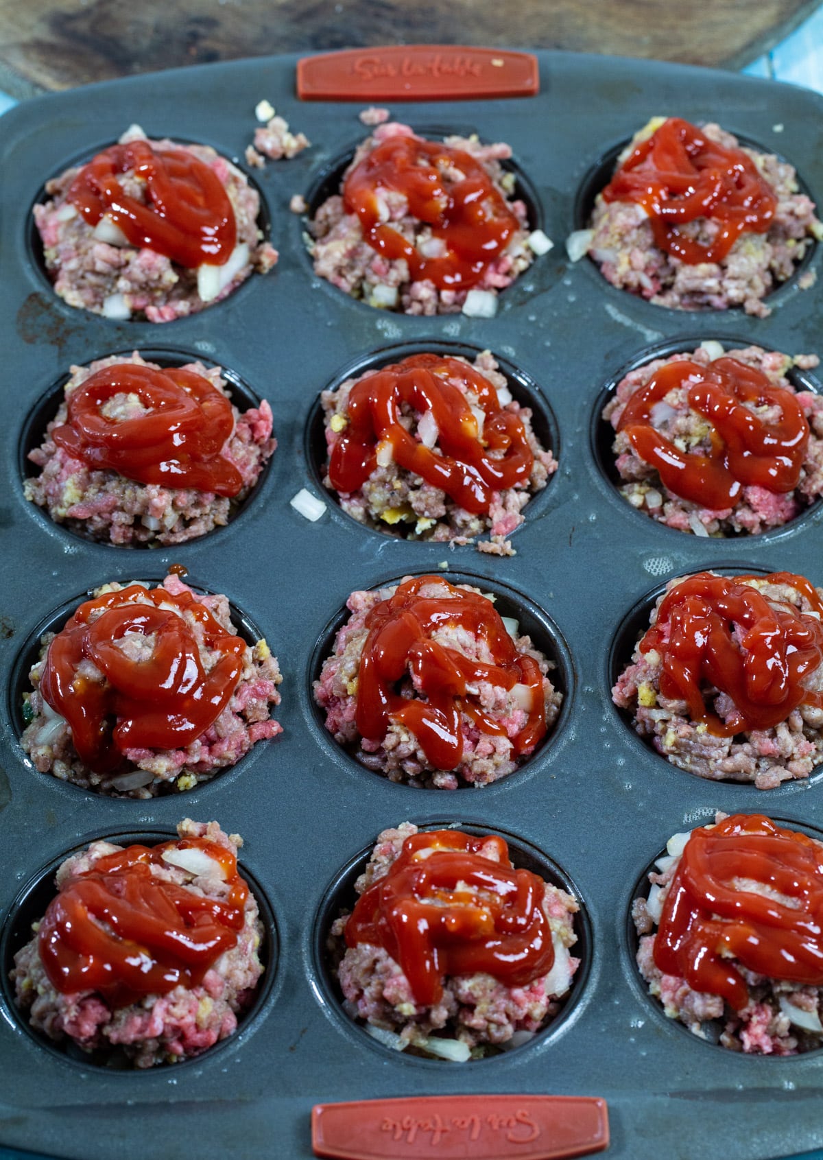 Ketchup on top of muffins.
