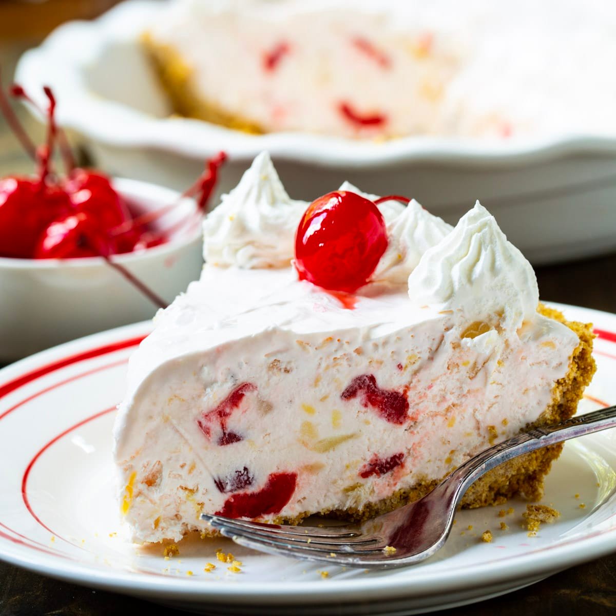 Slice of Retro Millionaire Pie topped with a cherry.