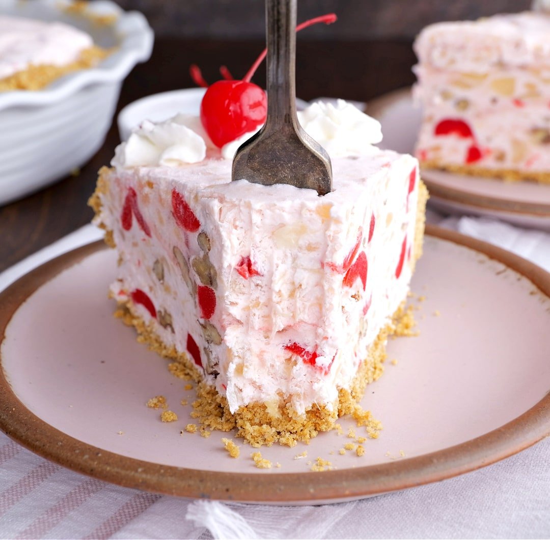 Fork going into a slice of pie.