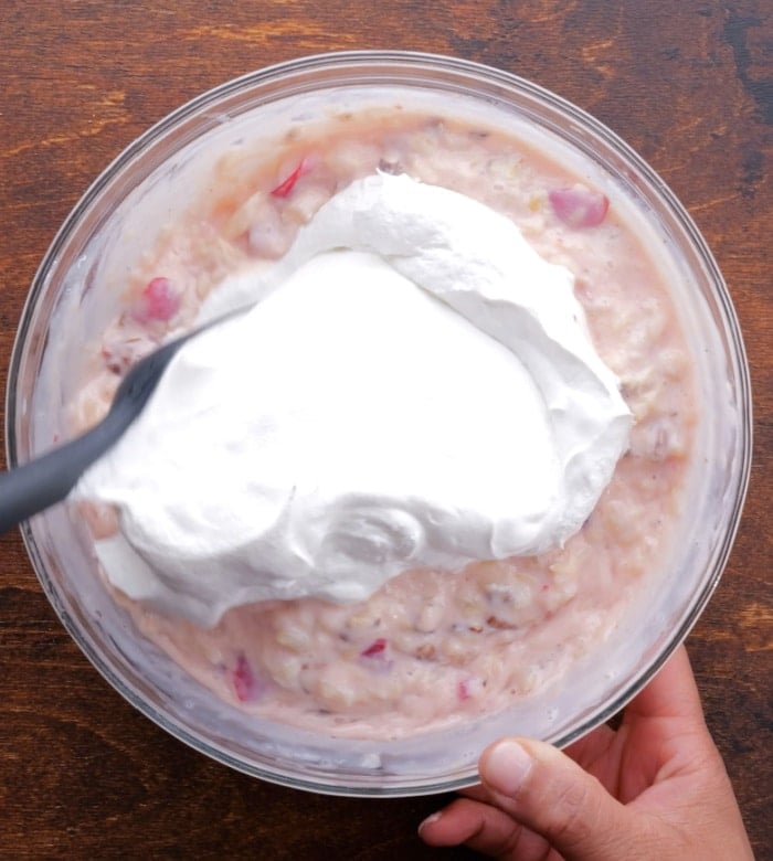 Adding Cool Whip to filling.