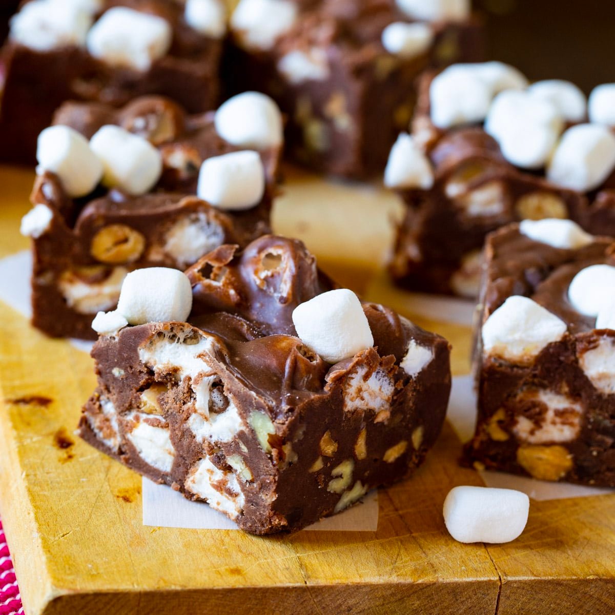 Squares of Rocky Road Fudge on a cutting board.