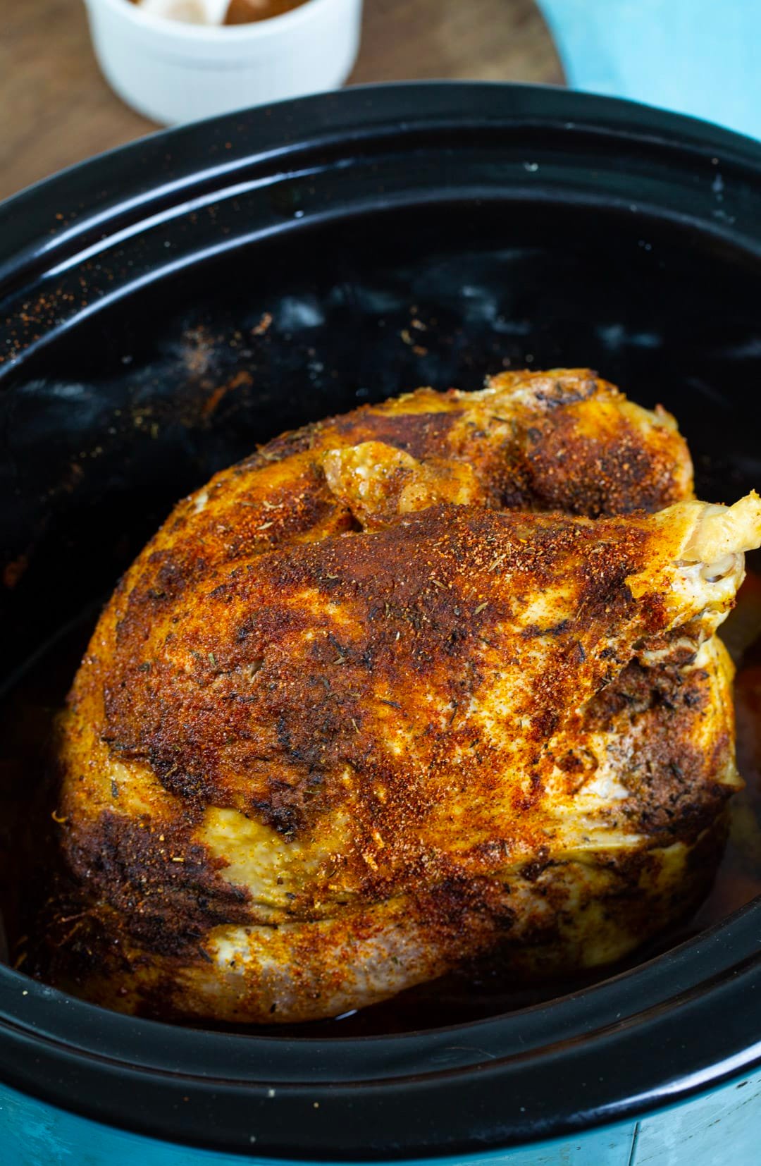 Cooked turkey breast in a slow cooker.