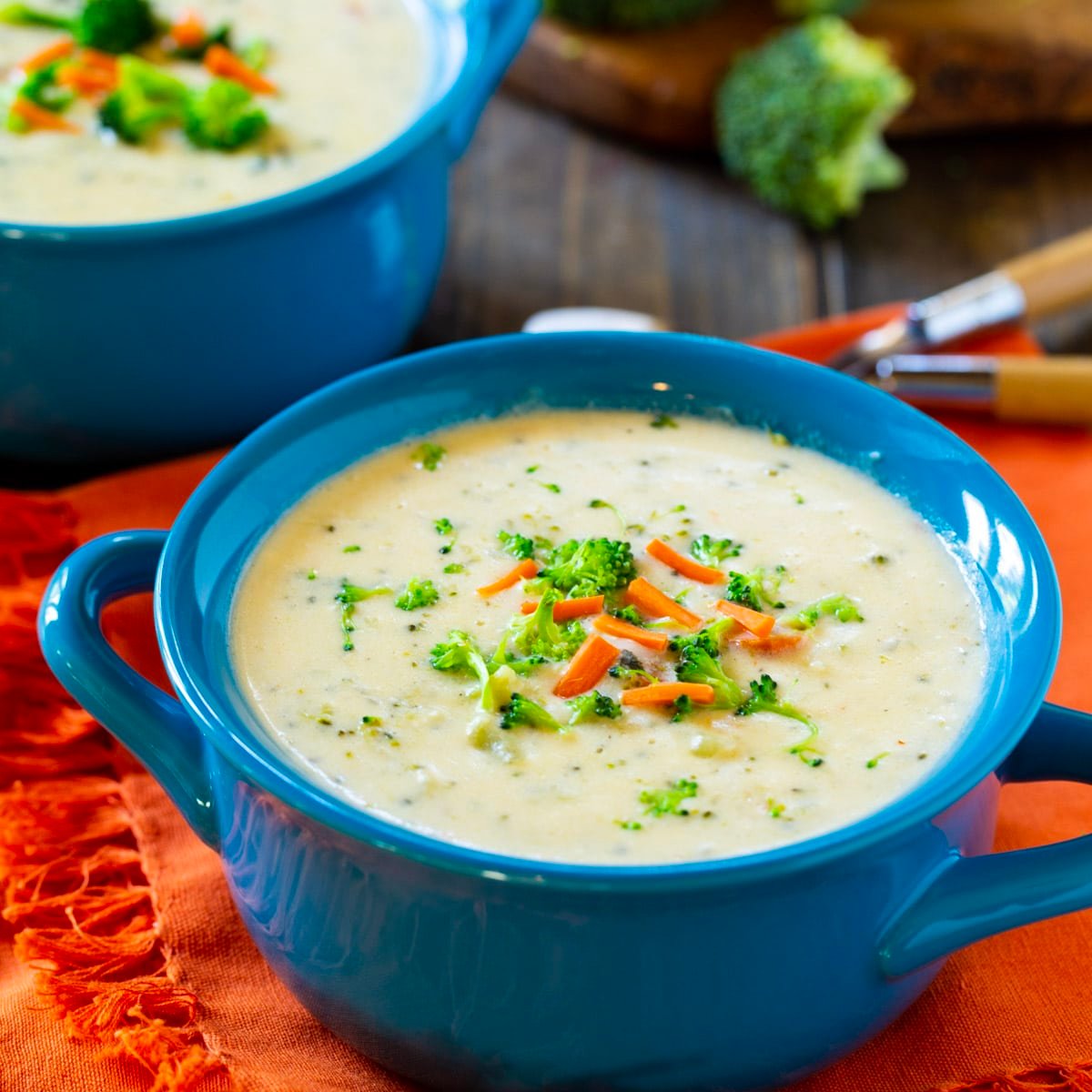 Broccoli Cheese Soup in a blue soup bowl.