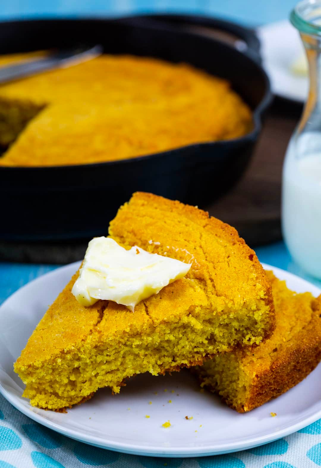 Buttermilk Cornbread topped with butter.