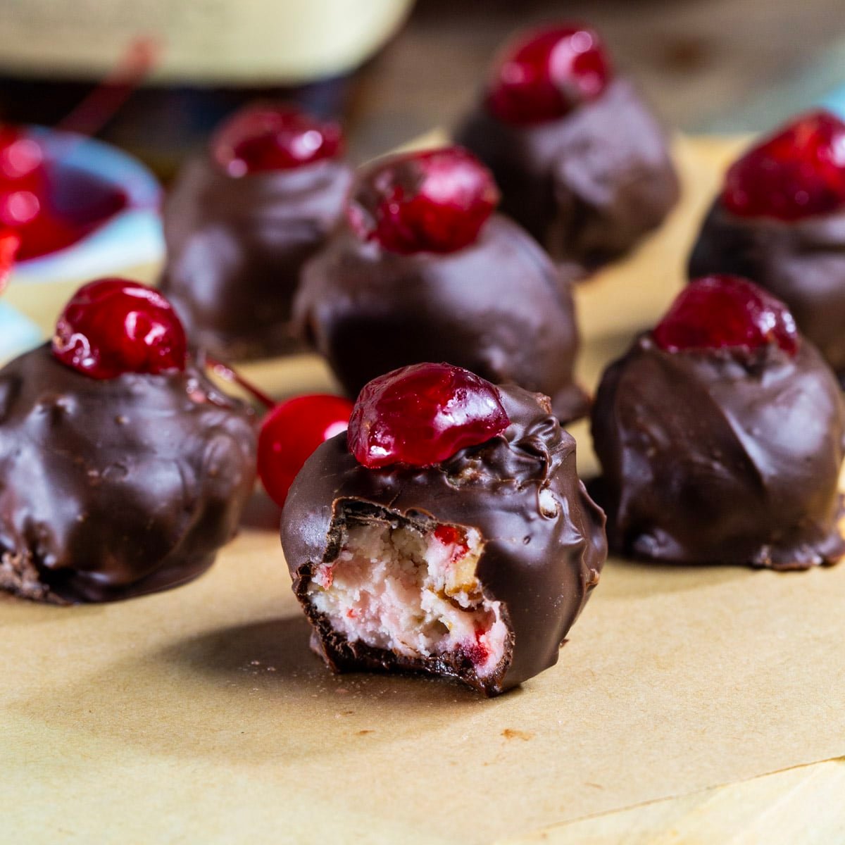 Cherry Bourbon Balls with a bite taken out of one.