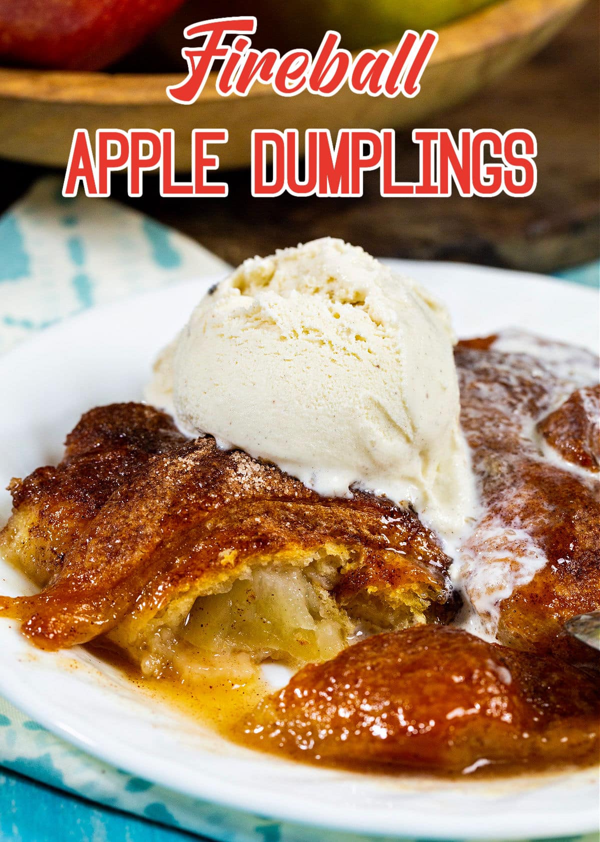 Fireball Apple Dumplings topped with vanilla ice cream.