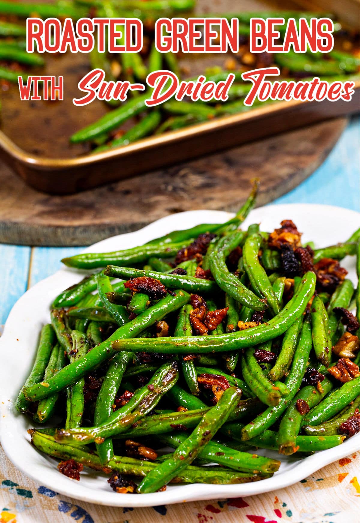 Roasted Green Beans with Sun-Dried Tomatoes on serving plate.