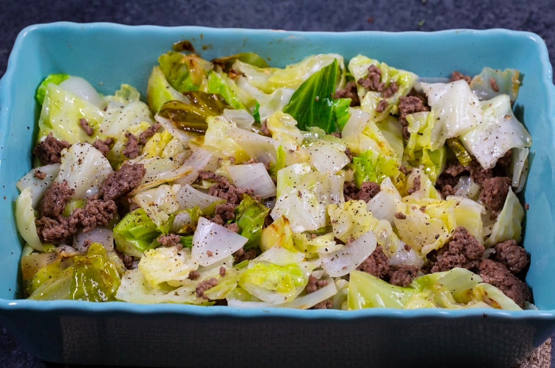 Cabbage ground beef mixture in baking dish.