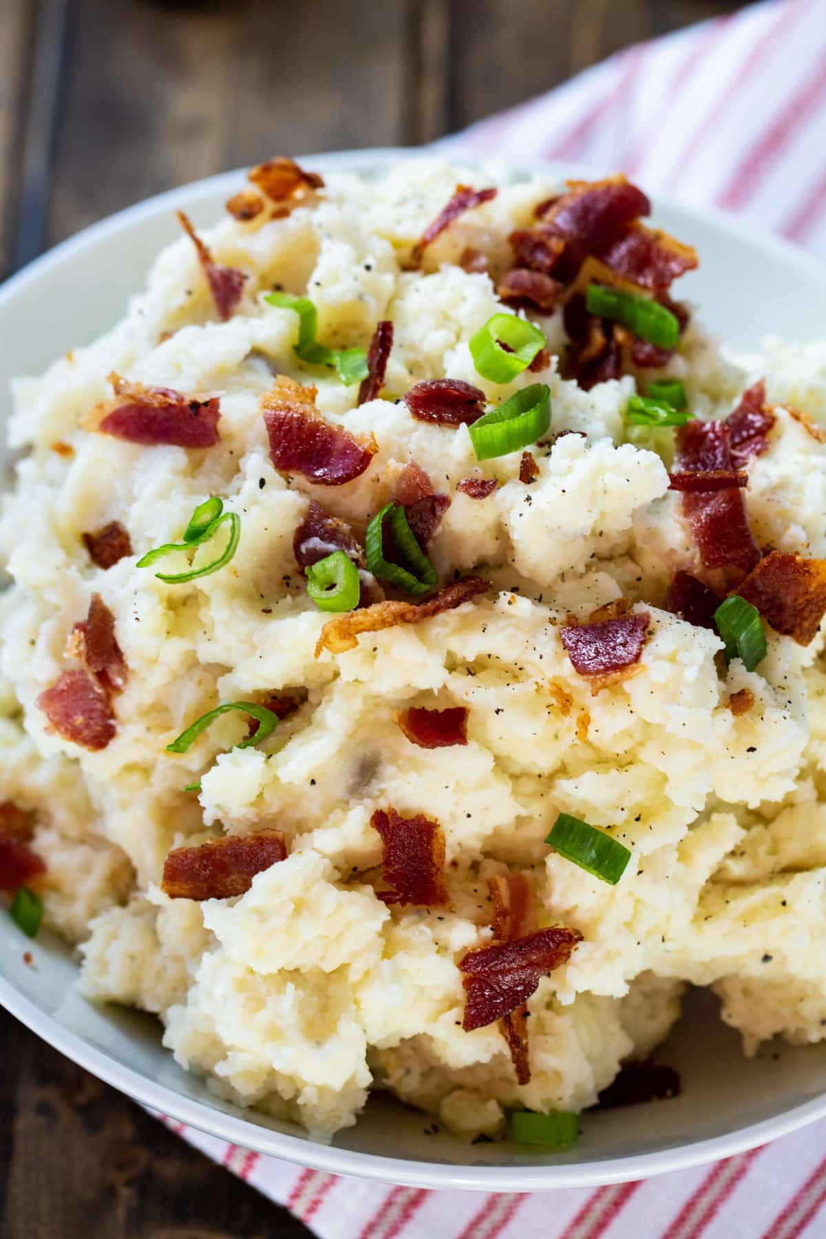 Close-up of mashed of potatoes topped with bacon.