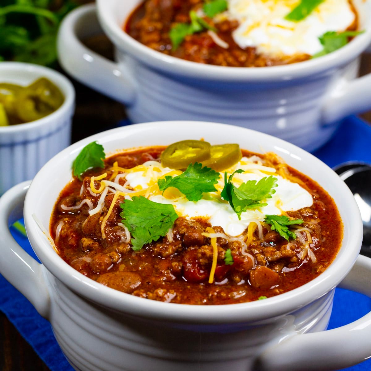 Rotel Chili topped with sour cream, cilantro and jalapenos.