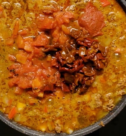 Adding Worcestershire sauce.