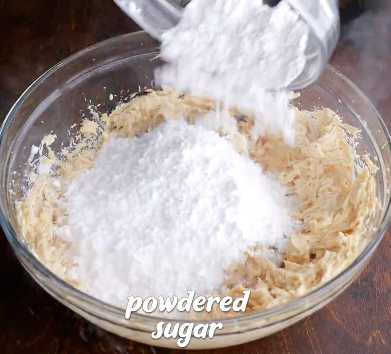 Mixing in powdered sugar.