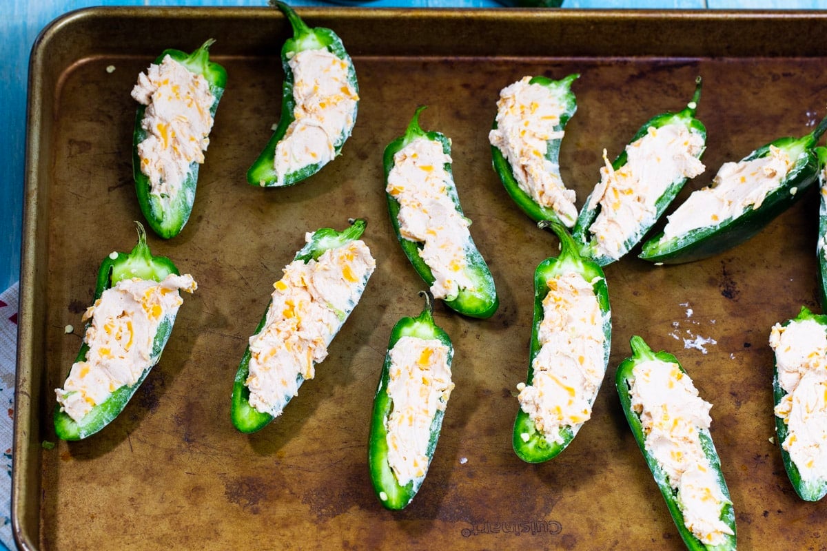 Raw jalapenos stuffed with cream cheese mixture.