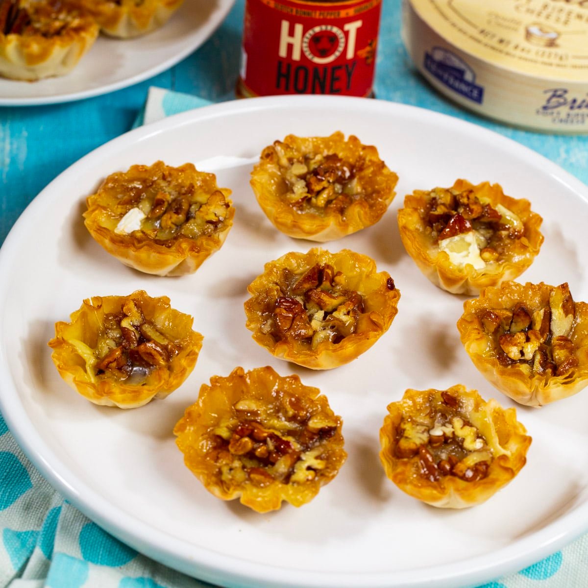 Bourbon Pecan Brie Bites on a plate.