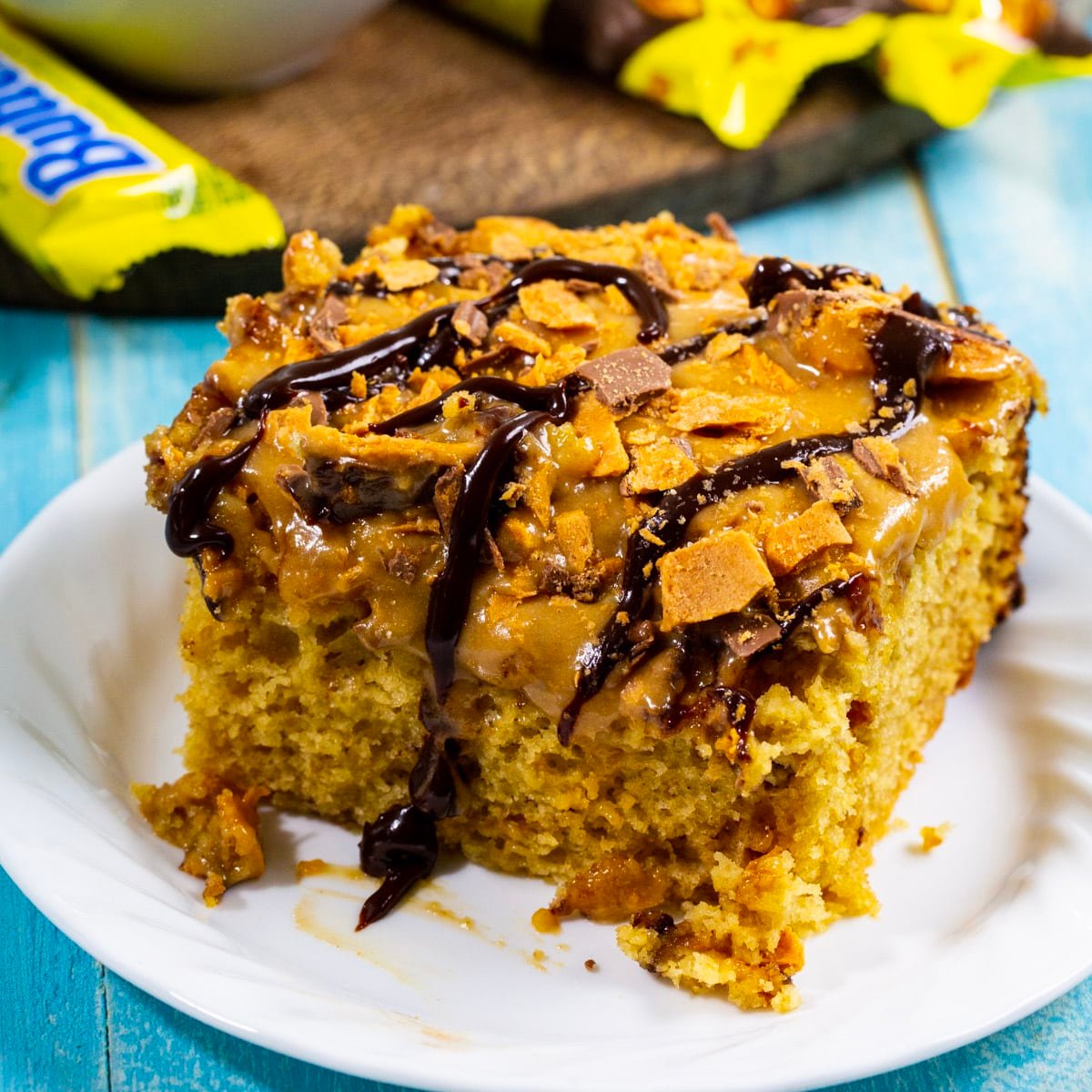 Square of Slow Cooker Butterfinger Cake on a plate.