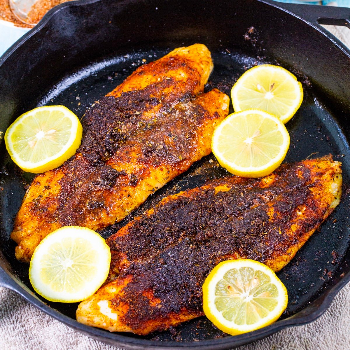 Blackened Catfish in cast iron skillet.