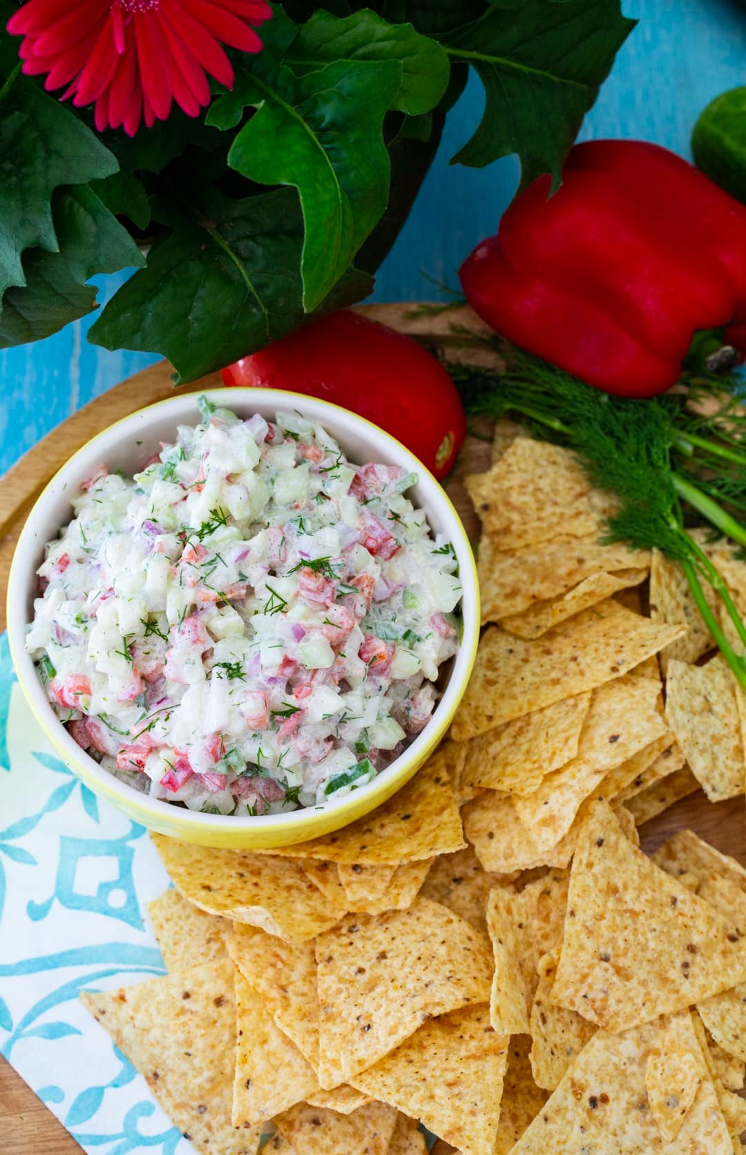 Creamy Cucumber Salsa in a bowl surrounded by tortilla chips.