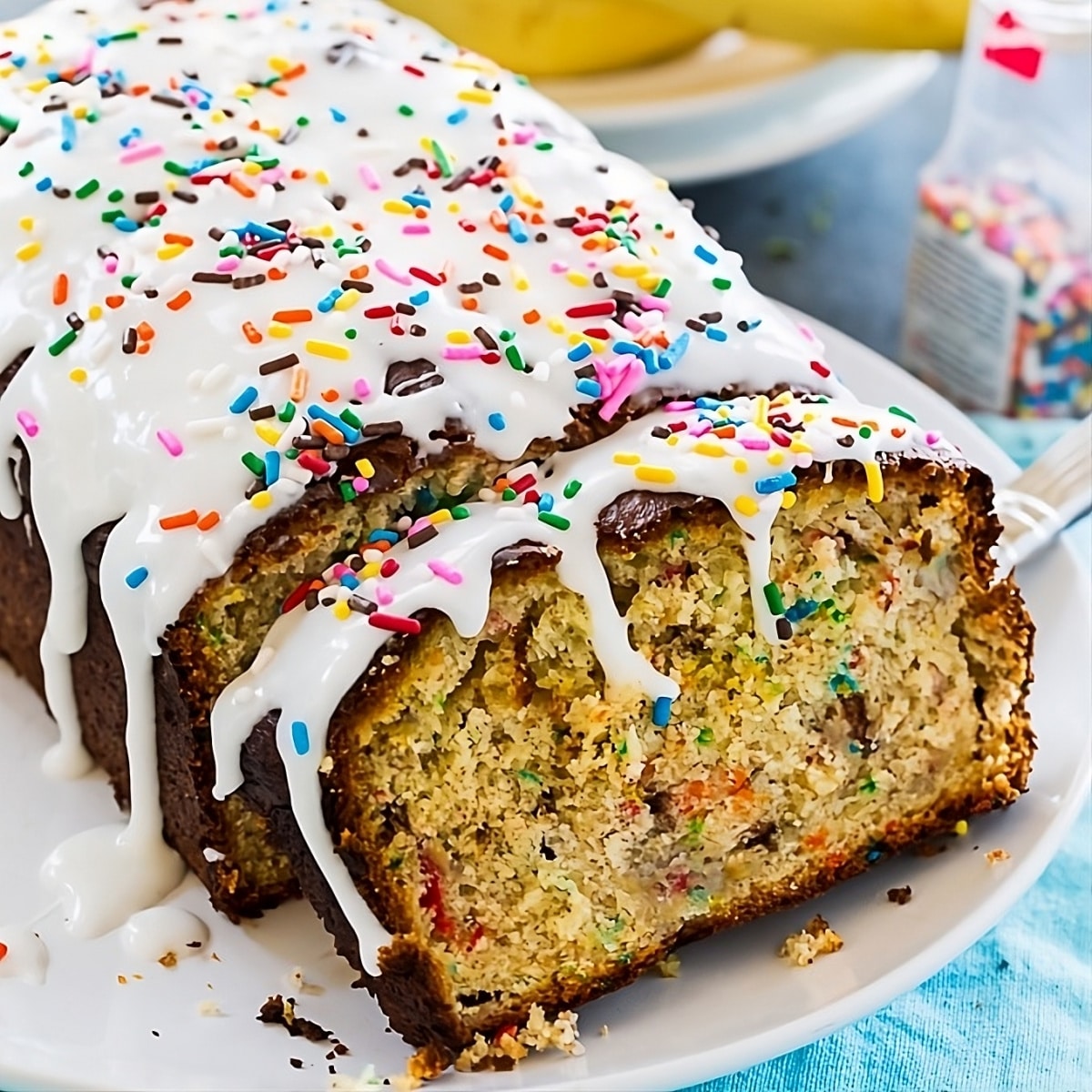 Funfetti Banana Bread with a slice cut.