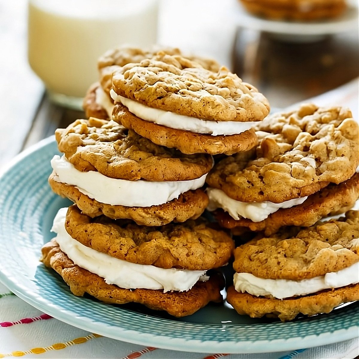 Oatmeal Sandwich Cookies piled up on a plate.