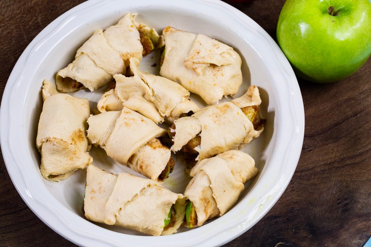 Unbaked dumplings in baking dish.