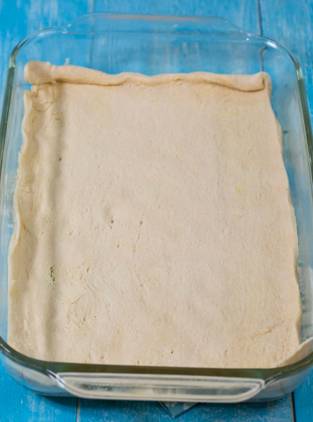 Crust unrolled in baking dish.